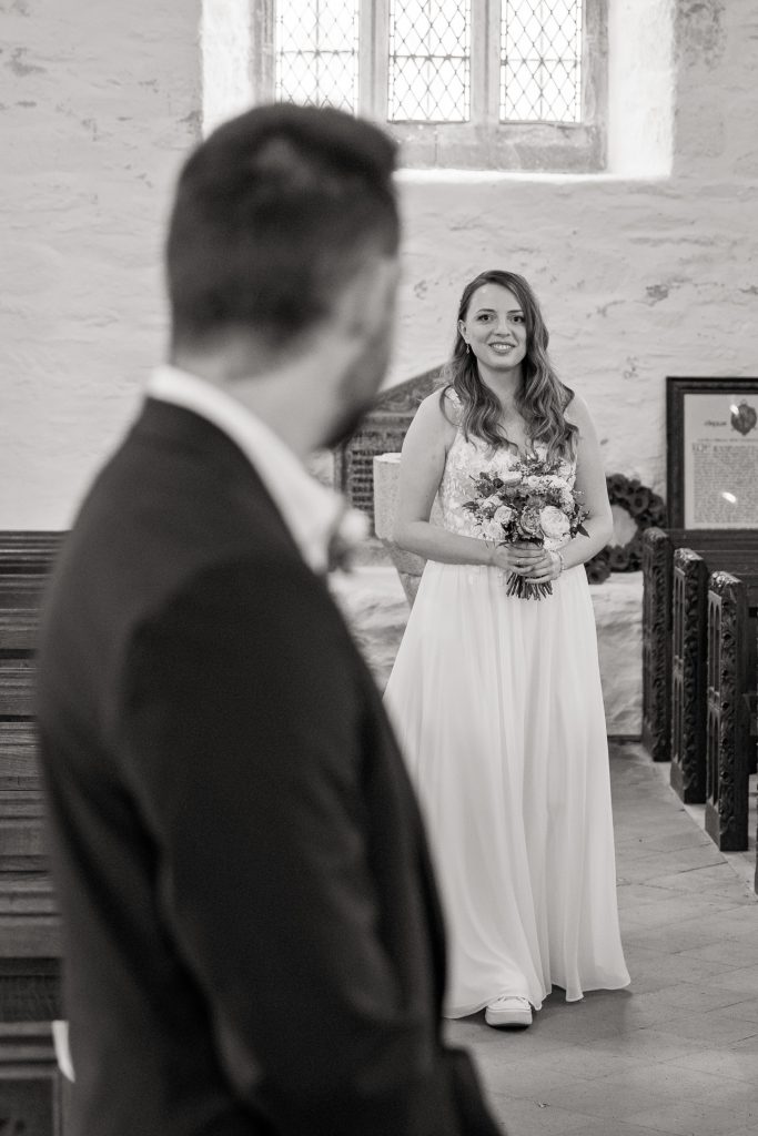 Intimate wedding in Cornwall, Bride first sets her eyes on the Groom as she walks up the aisle
