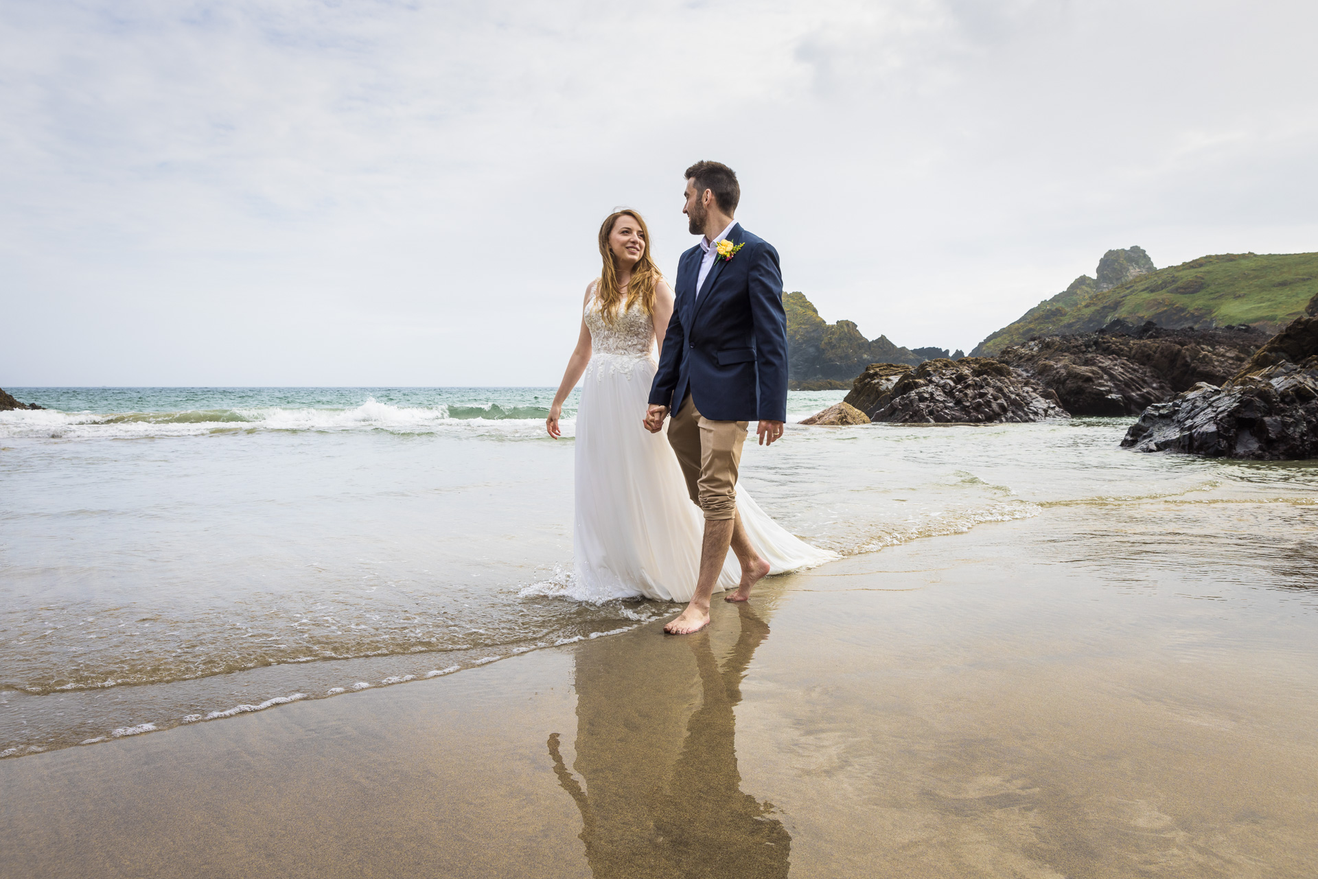 Bride & Groom in the Sea at Kynance Cove on the Lizard in Cornwall following their elopement Wedding at Gunwalloe